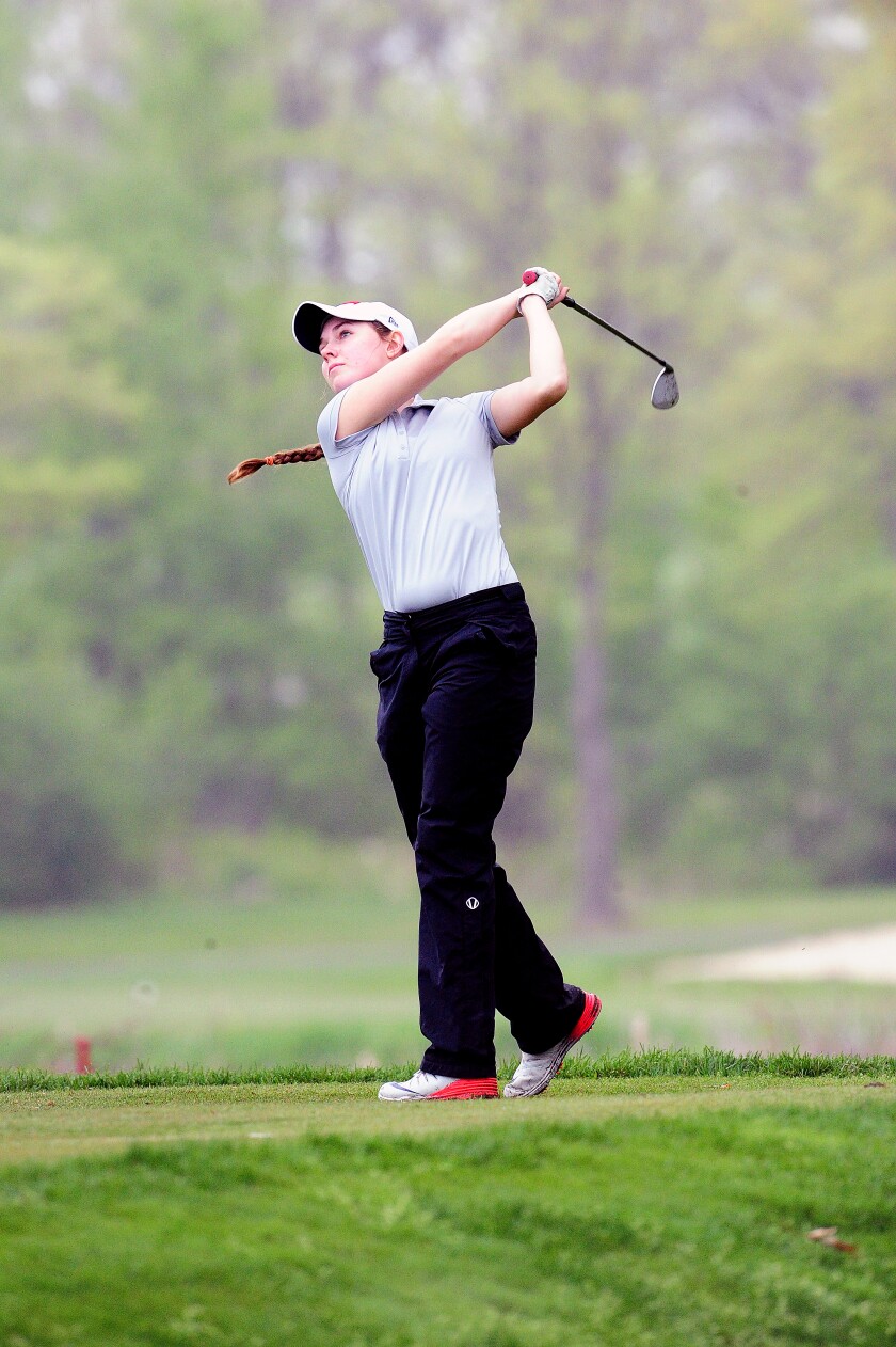 Pequot Lakes Patriot Alex Stone uses an iron Wednesday to drive her ball at the Classic at Madden’s Resort, Stone went on to become the medalist with a score of 77 at the Classic Invite. Steve Kohls/ Brainerd Dispatch