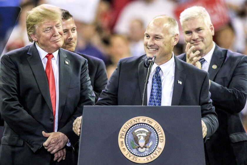 President Donald Trump welcomes Minnesota 8th Congressional candidate Pete Stauber to the stage at Amsoil Arena in Duluth Wednesday evening. A capacity crowd of 8,372 people were in attendance. (Clint Austin / caustin@duluthnews.com)