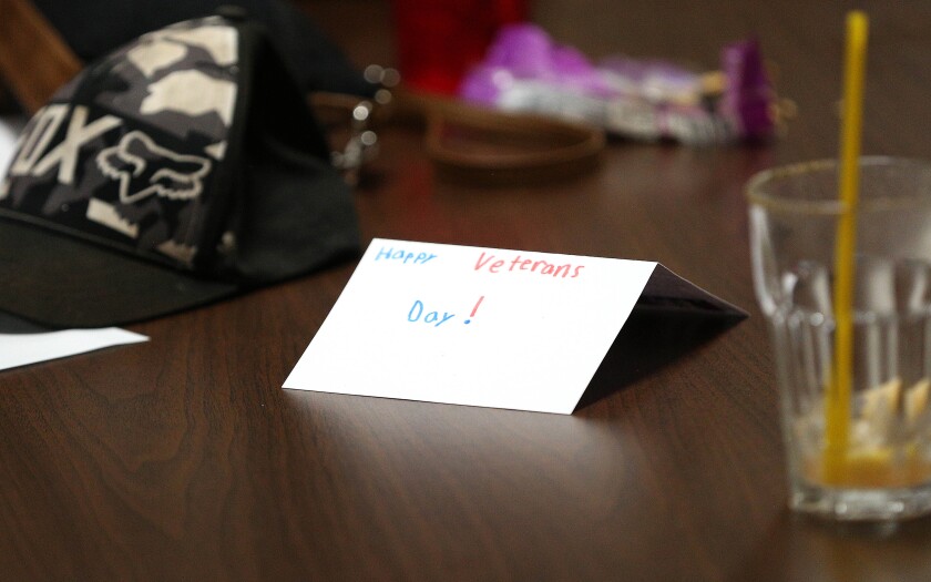 A handmade card for Veterans Day sitting on a table.