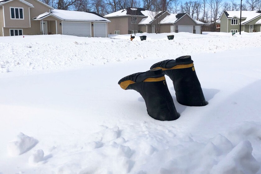 Boots in snowbank