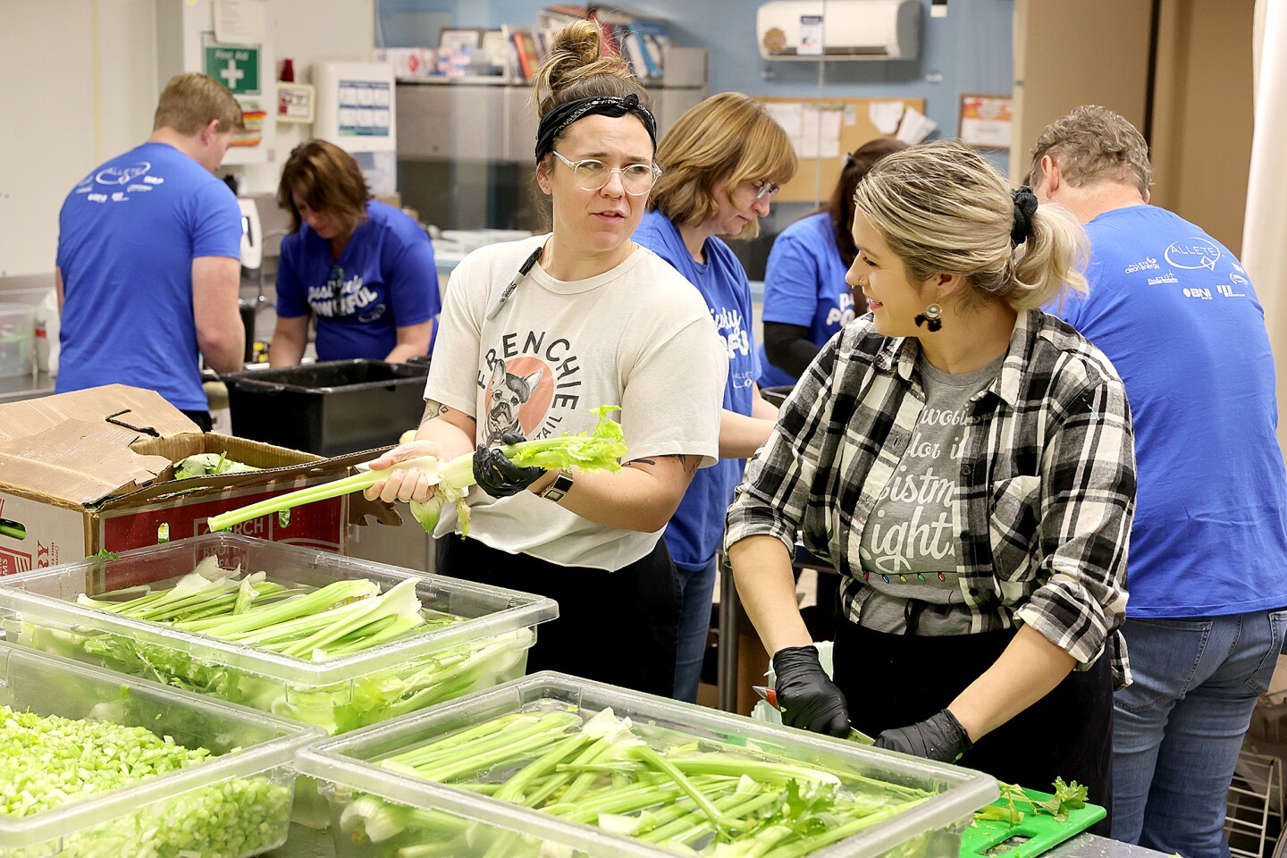 Women work on celery.