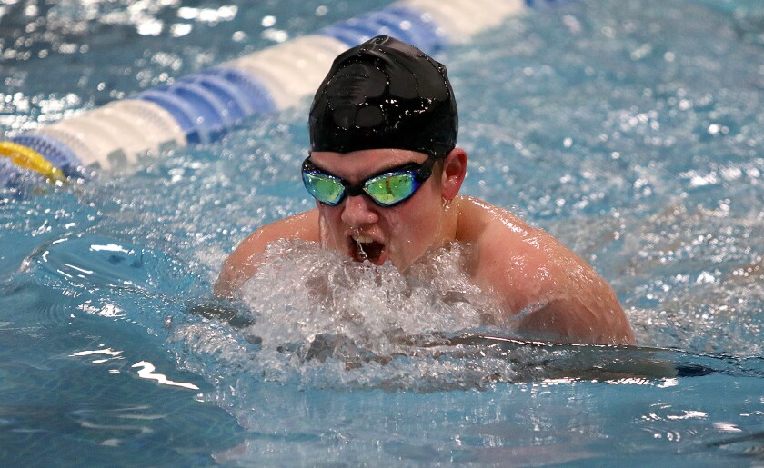Male swimming breaststroke.