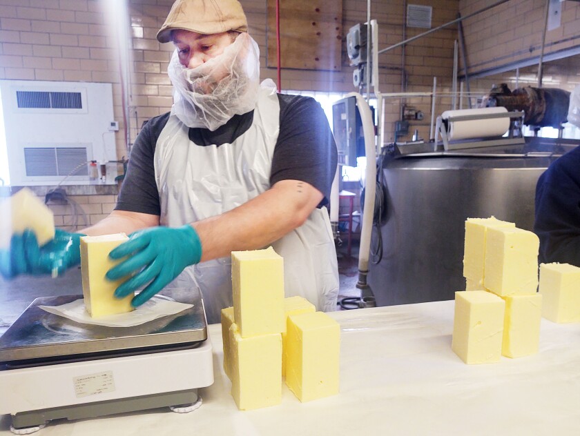 Eric Hubbard is in his third year as the Millerville Creamery's butter maker. He makes, cuts and weighs the butter, which is then wrapped and packed by other employees.