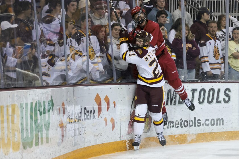 college hockey players play ice hockey