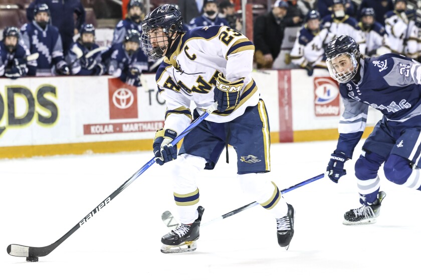 high school boys play ice hockey