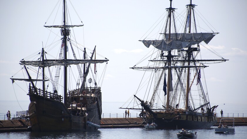 Two ships docked next to each other.