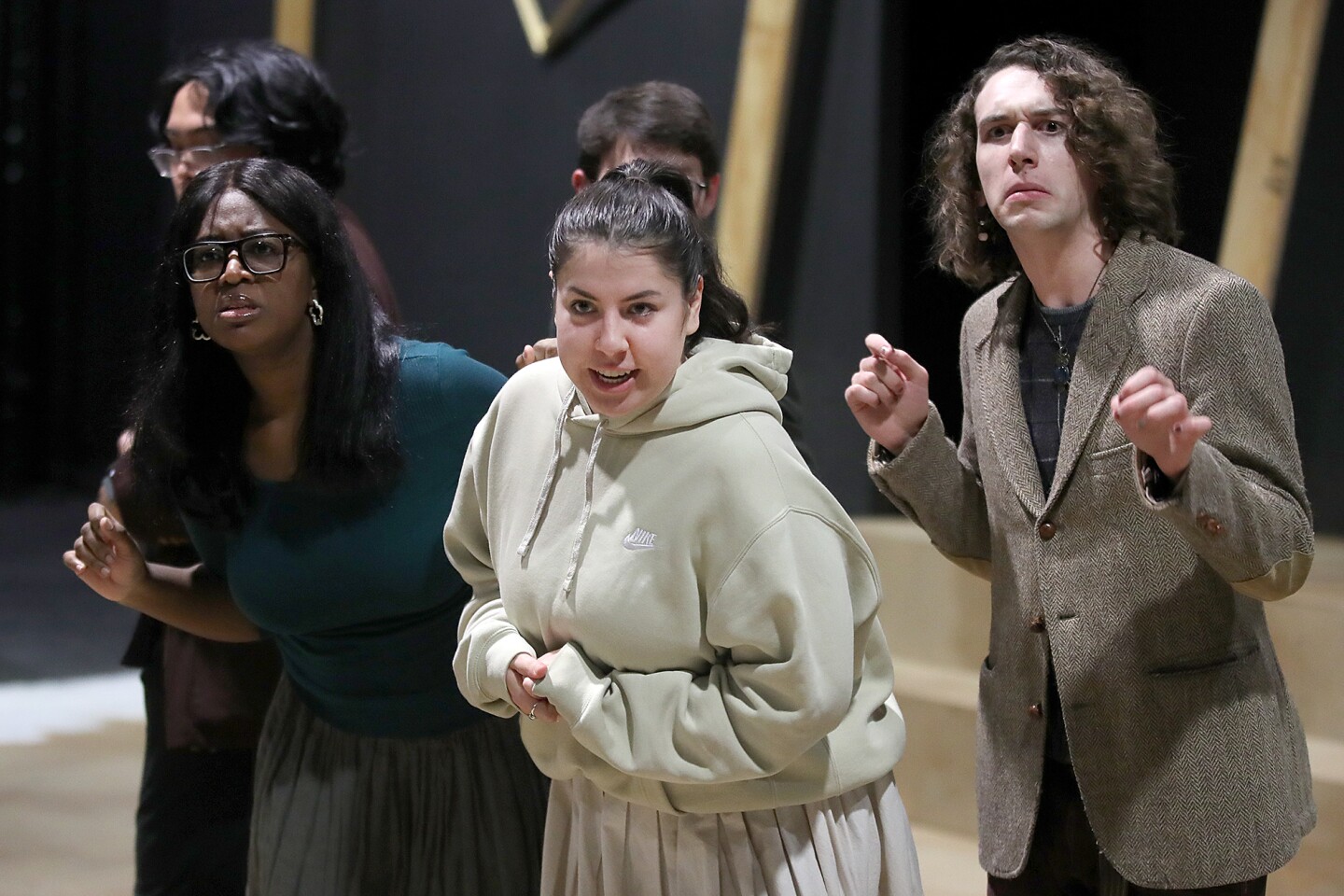 Actors perform during rehearsal.
