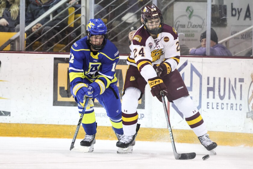 college men play ice hockey