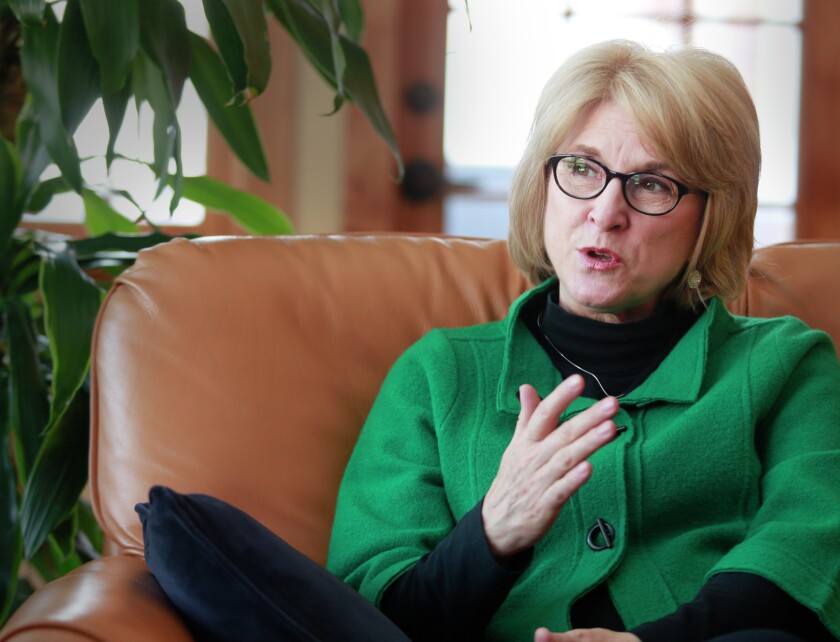 Debbie Kennedy discusses her role as UND's first lady last week in the president's home on the UND campus. photo by Eric Hylden/Grand Forks Herald