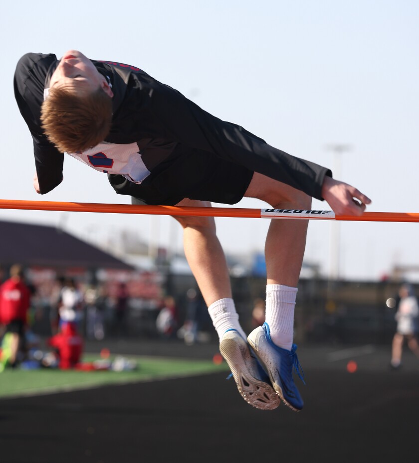 Heron Lake-Okabena High School Coyotes Logan Gass clears the bar during the Track and Field events in Worthington Tuesday afternoon.