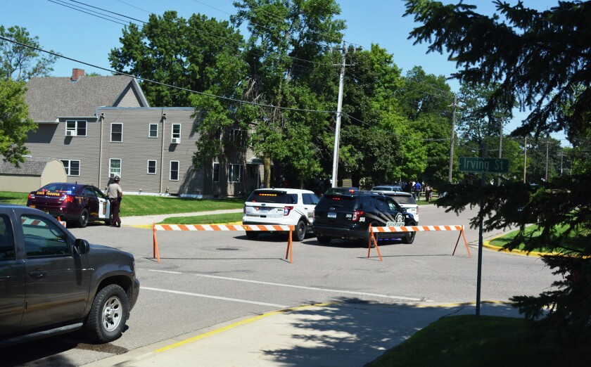 Law enforcement block off a street in Alexandria, Minn. Forum News Service