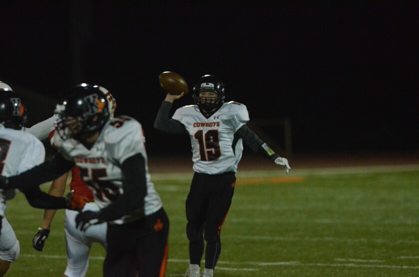 Killdeer senior quarterback Dylan Tabor fires a pass against Dickinson Trinity on Friday, Sept. 28 from the Biesiot Activities Center. (Patrick Bernadeau/The Dickinson Press)