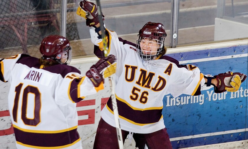 News Tribune File PhotoMinnesota Duluth's Jessica Koizumi (right) celebrates a second period goal with teammate Noemie Marin during a Dec. 2006 game against Ohio State at the DECC. Koizumi returns to Duluth this weekend as associate head coach of the Buckeyes.