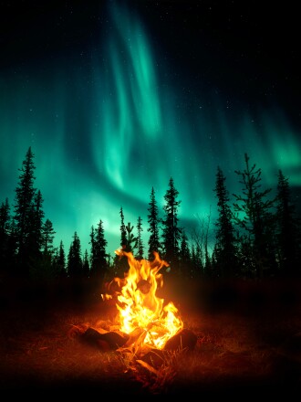 Campfire In The Wilderness With The Northern Lights