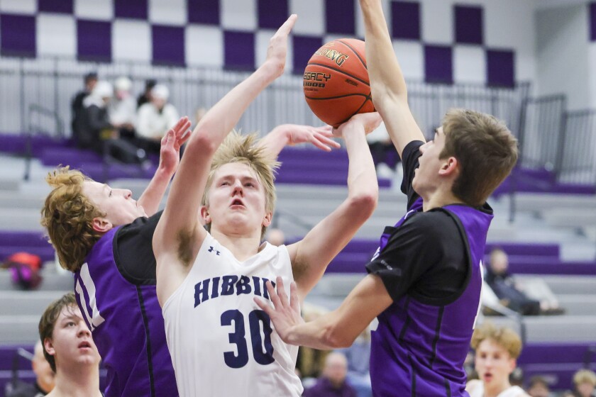 high school boys play basketball