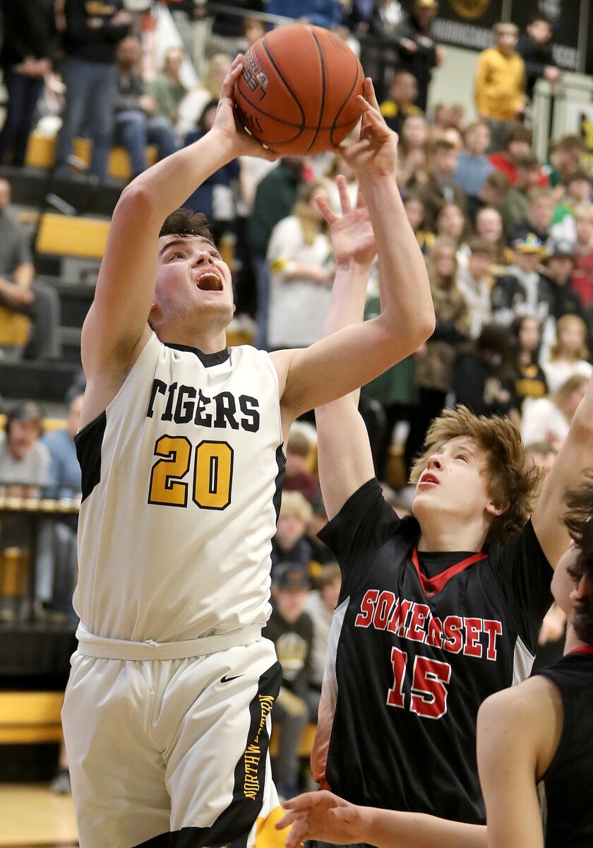 Northwestern’s Mason Dupree (20) gets a shot up over Somerset’s Kane Donnelly (15)