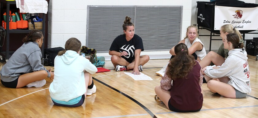 Solon Springs head volleyball coach Ciara Simenson, center, talks to her team before practice