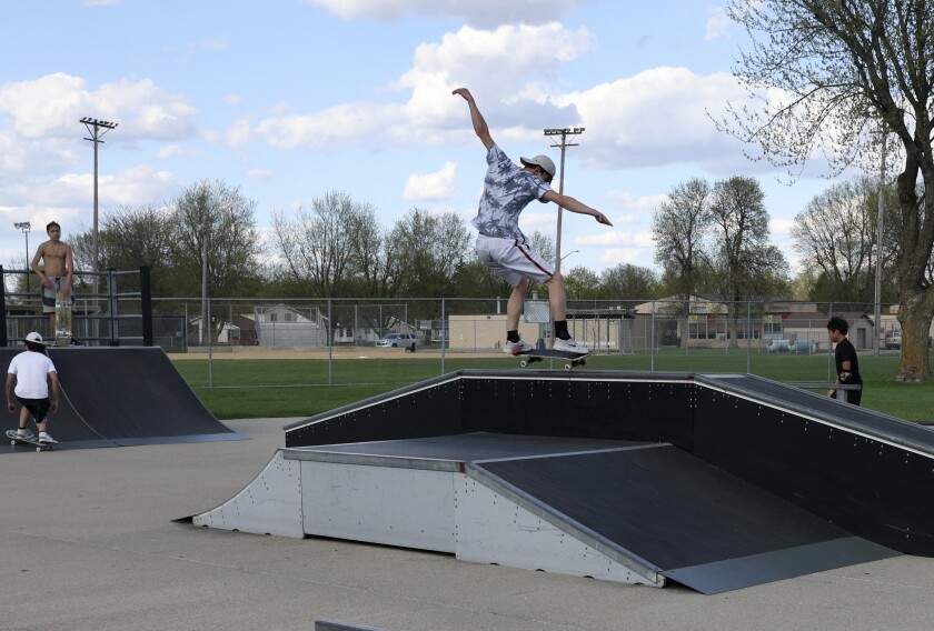 Skateboarders practice their moves at Worthington's local park on Sunday, May 15, 2022.