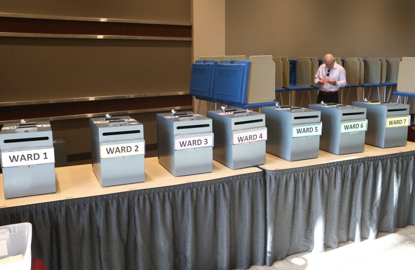 Hal Gershman reviews his ballot Tuesday at the Arbor Park vote at the Alerus Center.photo by Eric Hylden/Grand Forks Herald
