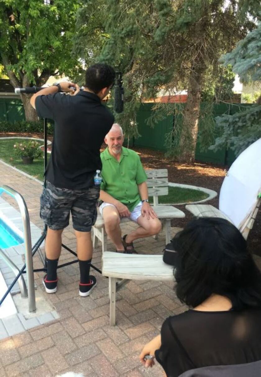 Bernie Erickson (left) and David Hamilton of Fargo appear on HGTV's "House Hunters International" tonight. They shot their audition video in their backyard. Special to The Forum