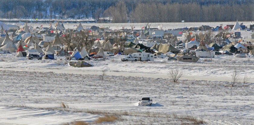 Despite extreme weather conditons the protest camp near Cannon Ball, North Dakota still has an estimated 2000 people who oppose the Dakota Access Pipeline. This photograph taken December 8, 2016 shows part of the encampment that has endured a prairie blizzard and subzero temperatures in the past week. People at the camp are asking that no new people come to visit or stay due to conditions but those presently there plan to keep a presence at the remote site. Photo by Tom Stromme / Bismarck Tribune