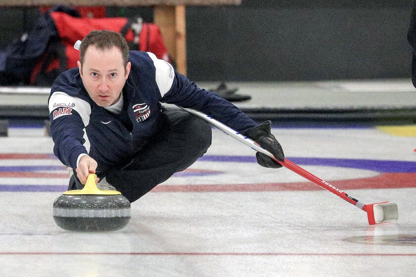 Olympic curler Tyler George of Duluth throws a rock at the Duluth Curling Club on Tuesday evening. (Clint Austin / caustin@duluthnews.com)