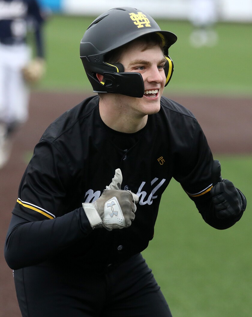Duluth Marshall's Mason Boos (5) gives his dugout a double thumbs up