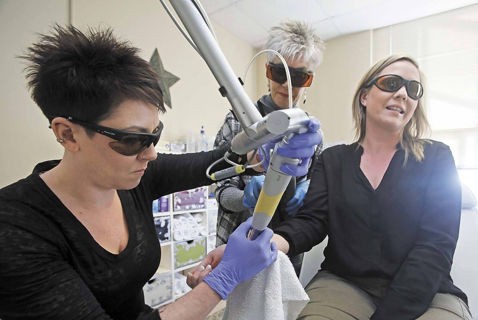 Mother and daughter operate tattoo removal studio as more people
