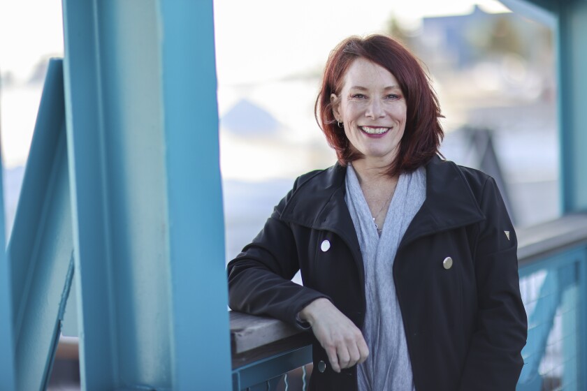 Cassandra Batchell leans against a railing