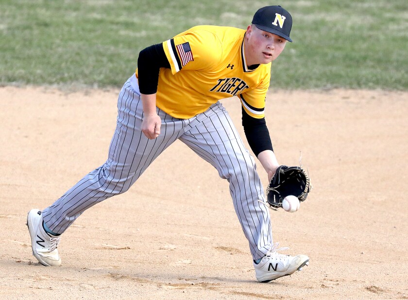 Northwestern’s Gunnar Olson (3) makes a play on a ball at third