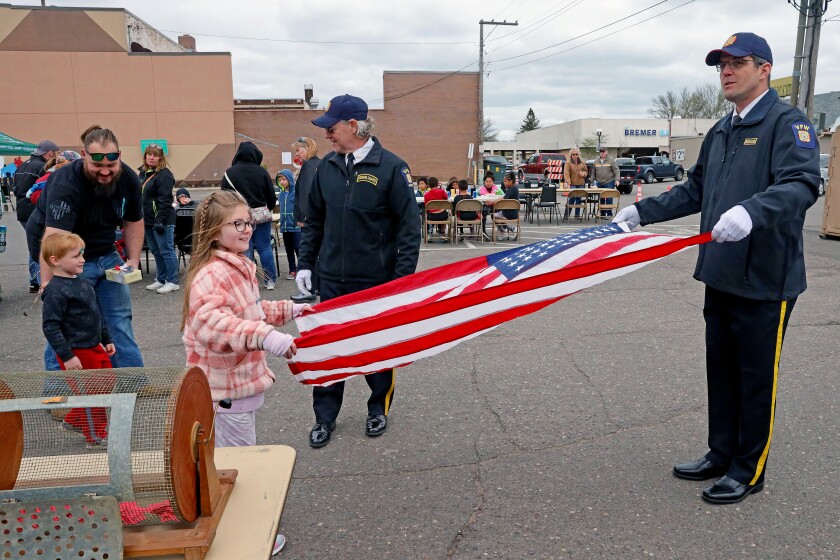 Flag folding during the Armed Forces Freedom Festival in Brainerd.