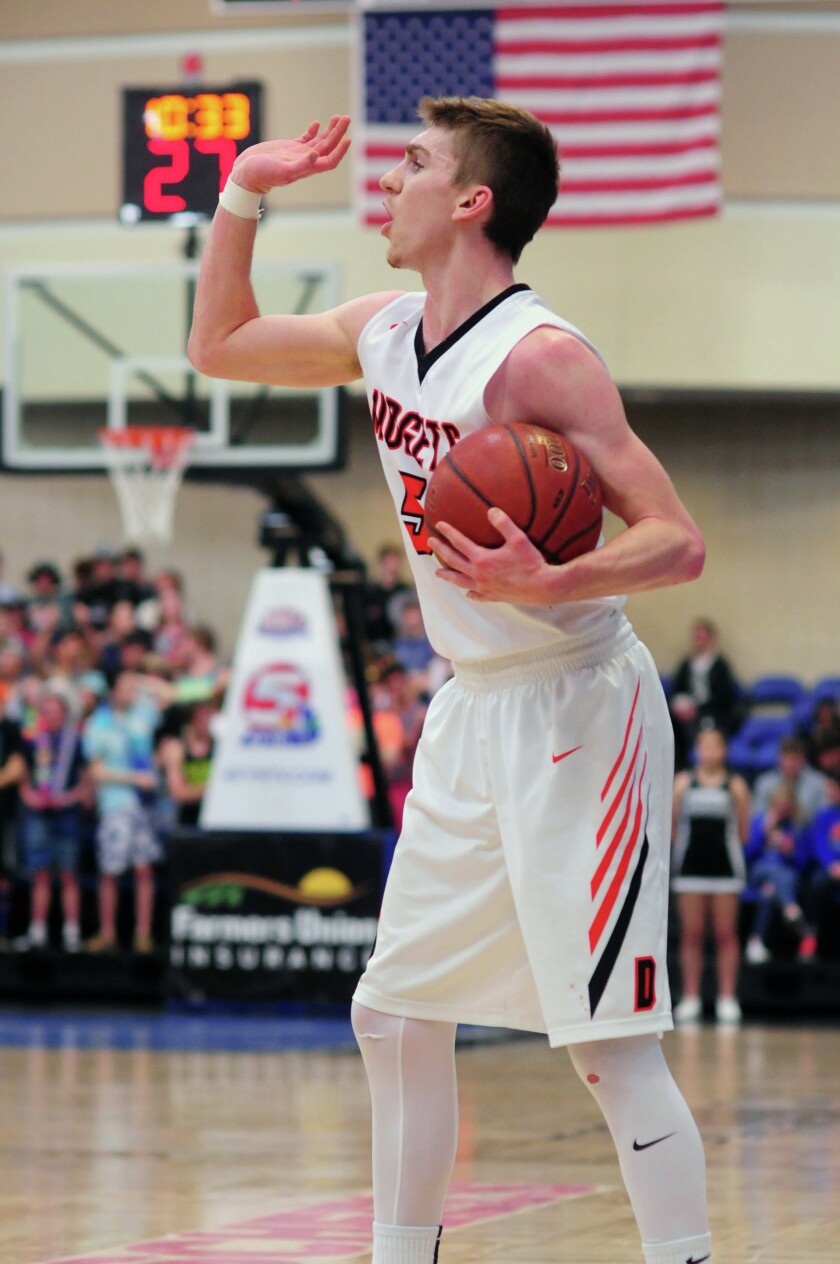 Dickinson High senior guard Aanen Moody calls out a play against Mandan during the West Region Tournament on March 3 at the Bismarck Event Center. (Parker Cotton / The Dickinson Press)