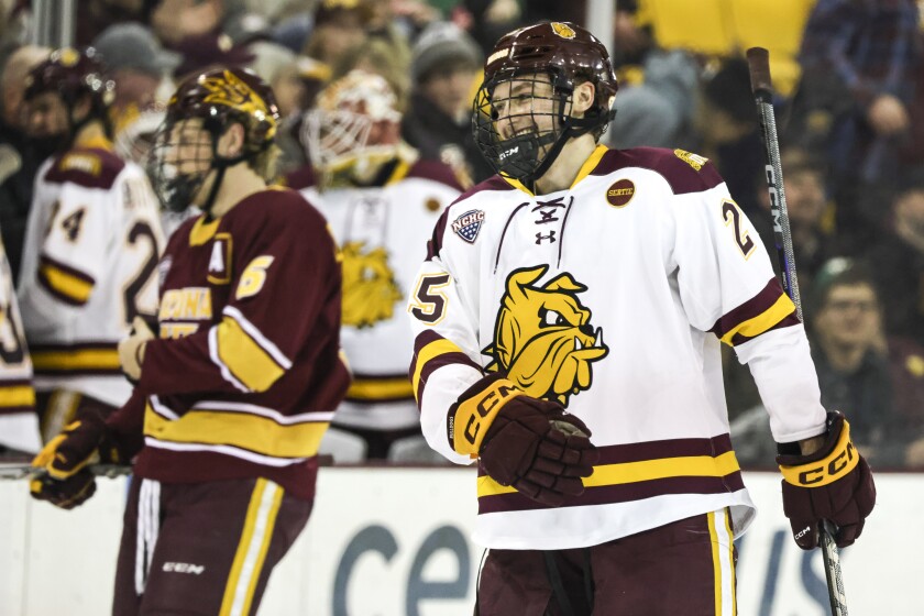 college men play ice hockey