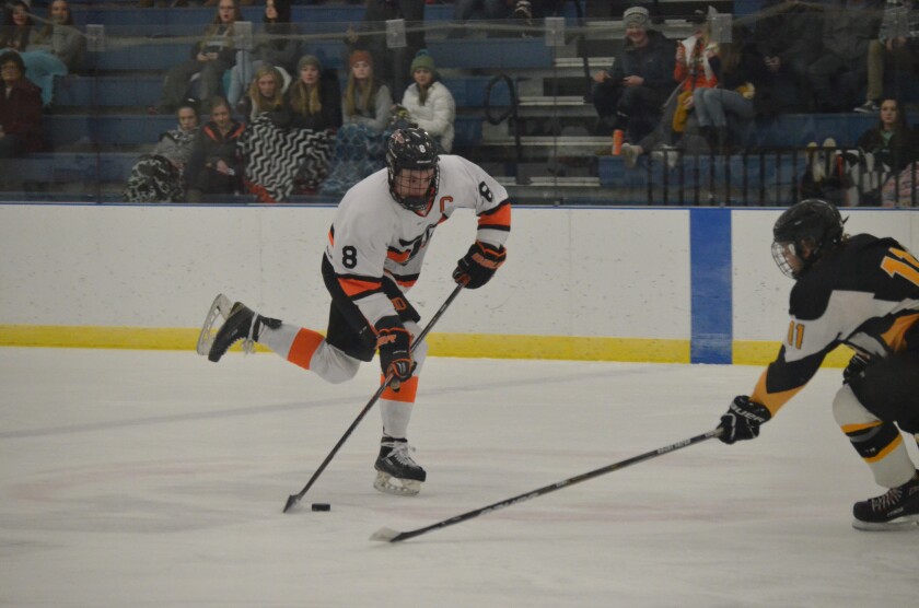Dickinson High junior forward Ryan Bren loads up a shot against Rapid City (S.D.) on Dec. 27 from the West River Ice Center (Patrick Bernadeau/The Dickinson Press)