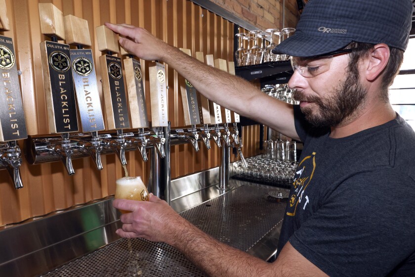 Man pulling a beer.