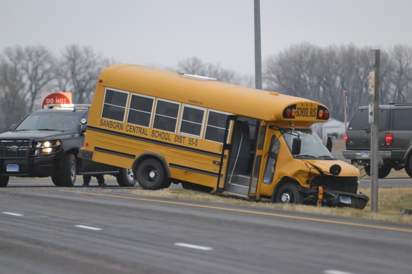 The South Dakota Highway Patrol and Sanborn County Sheriff’s Office respond to an accident between a car and a Sanborn Central School bus around 3:45 p.m. Monday at the intersection of Highways 37 and 34, about two miles east of Forestburg. (Garrick Hodge/Republic)