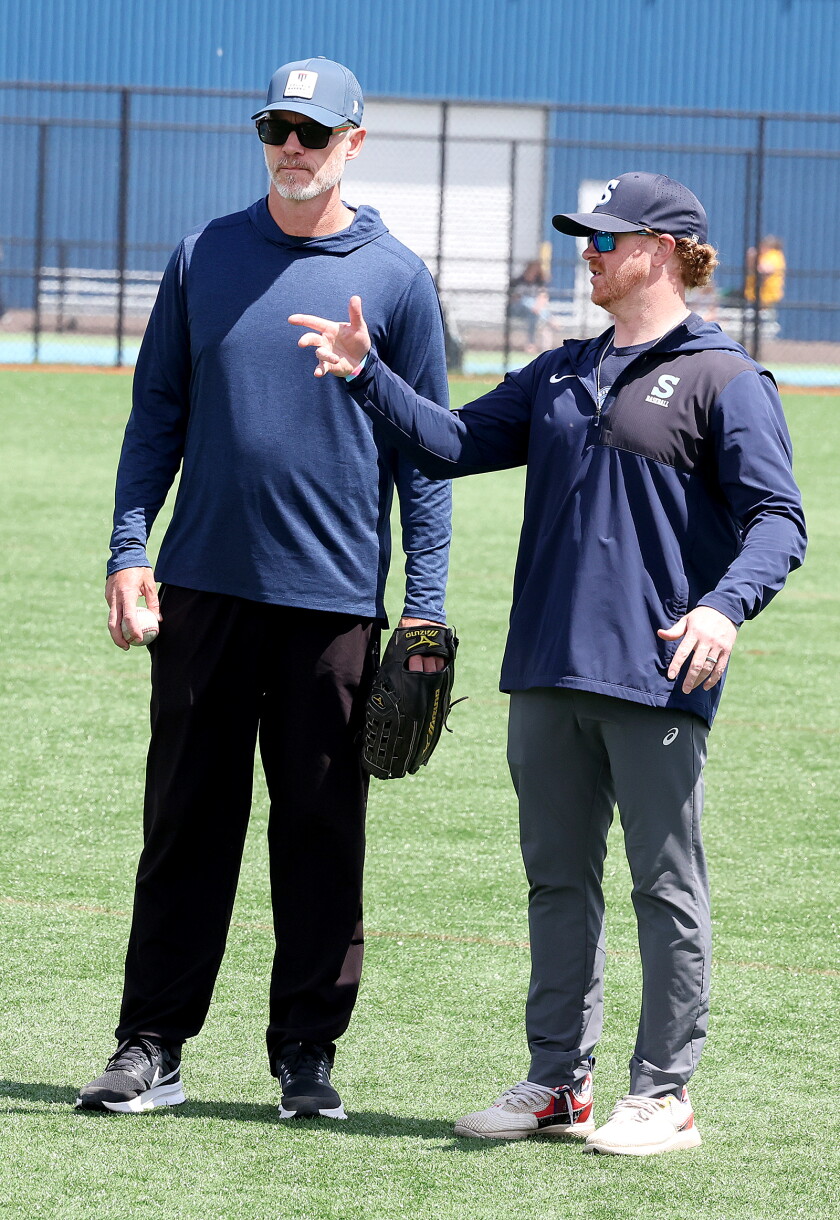 Coach talks to former MLB pitcher.