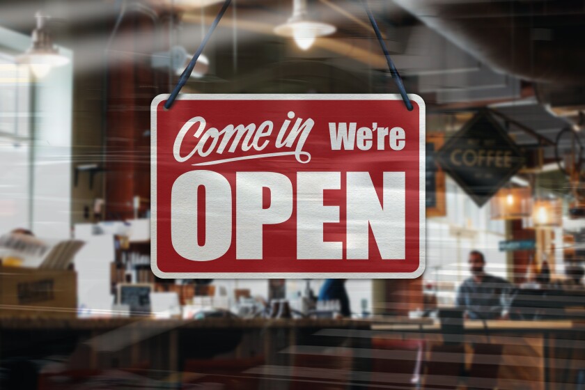 A red business sign that reads, "Come in we're open."