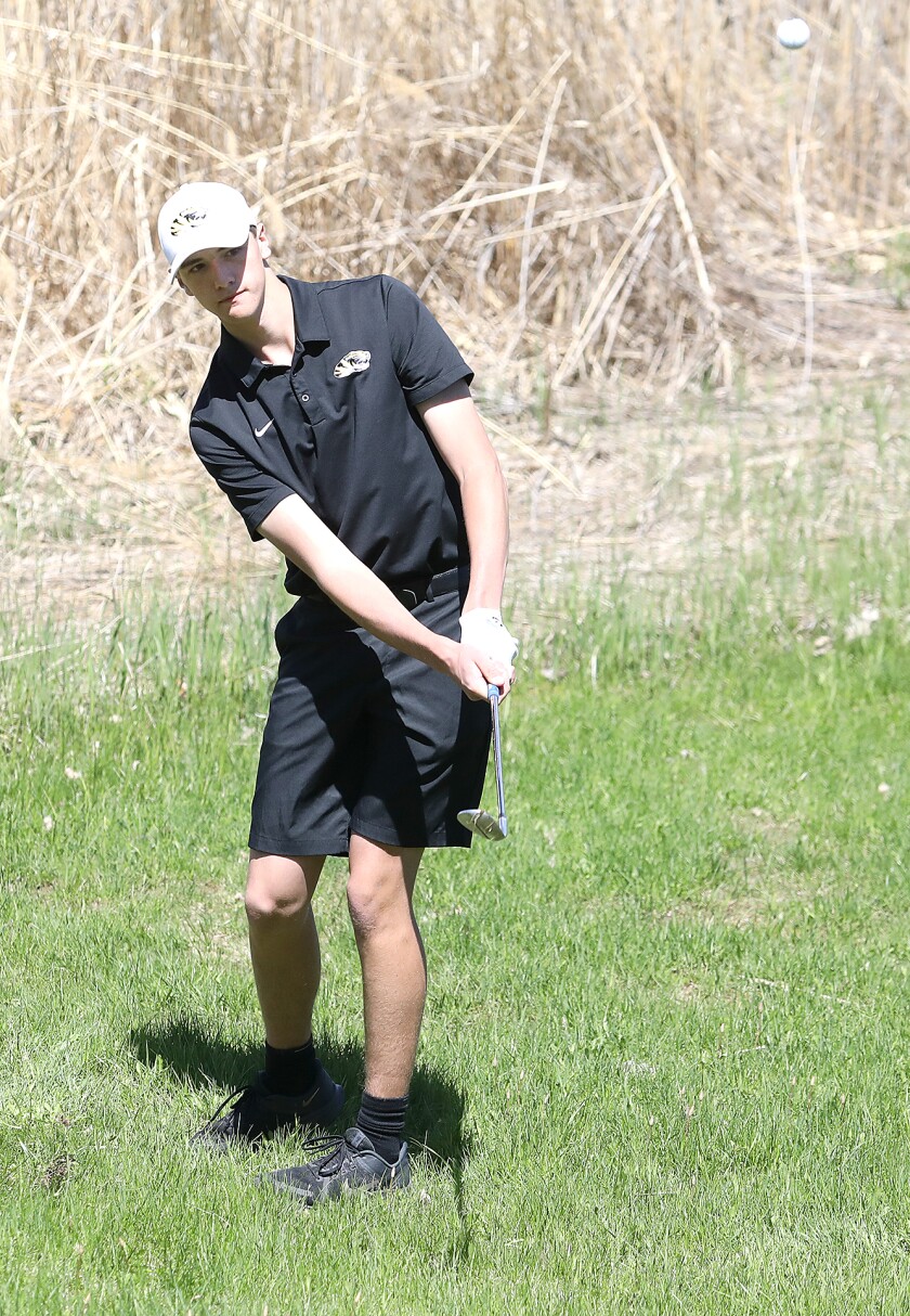 Trent Meyer chips outside of Northwestern High School