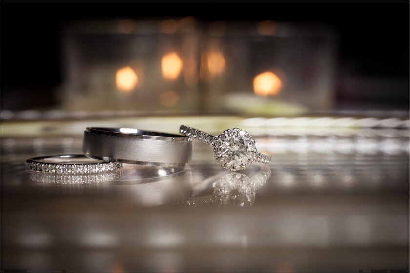 Wedding rings stacked on beautiful background