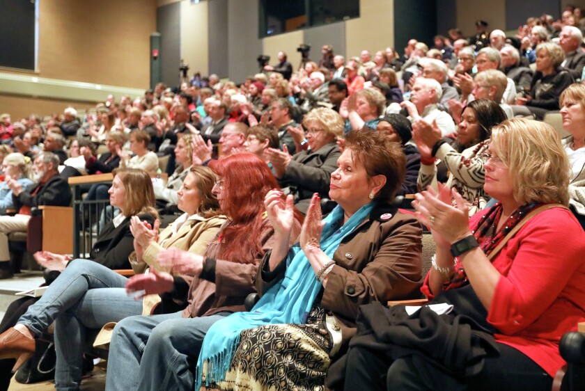 T03.20.2017 -- Steve Kuchera -- 032117.N.DNT.StateofcityC2 -- Sate of the city audience members applaud Mayor Emily Larson after she talked about battling the opioid problem. Steve Kuchera / skuchera@duluthnews.com