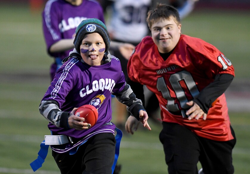 Cloquet’s Gentry Olson breaks away from Duluth East’s Gavin Reller (10) for a touchdown