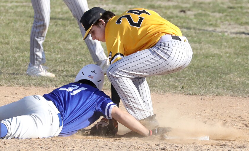 Northwestern’s Sean Moroney (24) tags out St. Croix Falls’ Dylan Smith (31) for a double play