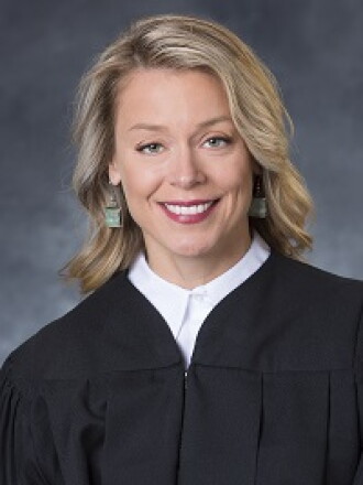 smiling judge in black robe