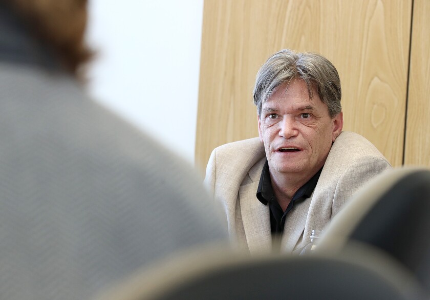 Brian Rickman, the station manager for The North 103.3, talks during an interview at PBS North