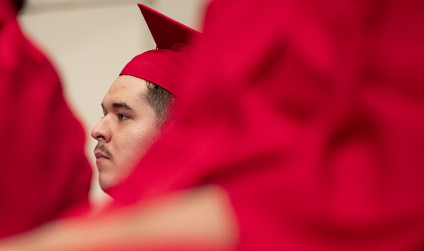 Area Learning Center graduate Lonnie Sanchez Jr listens to guest speakers during the school's senior graduation ceremony on Thursday, May 19, 2022, at the Willmar Arts & Education Center.