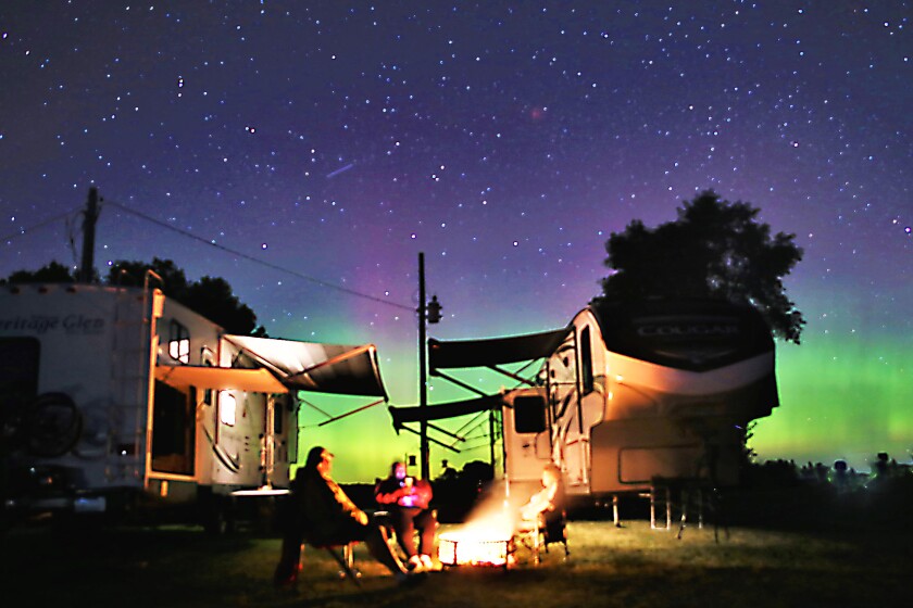 Campers with northern lights