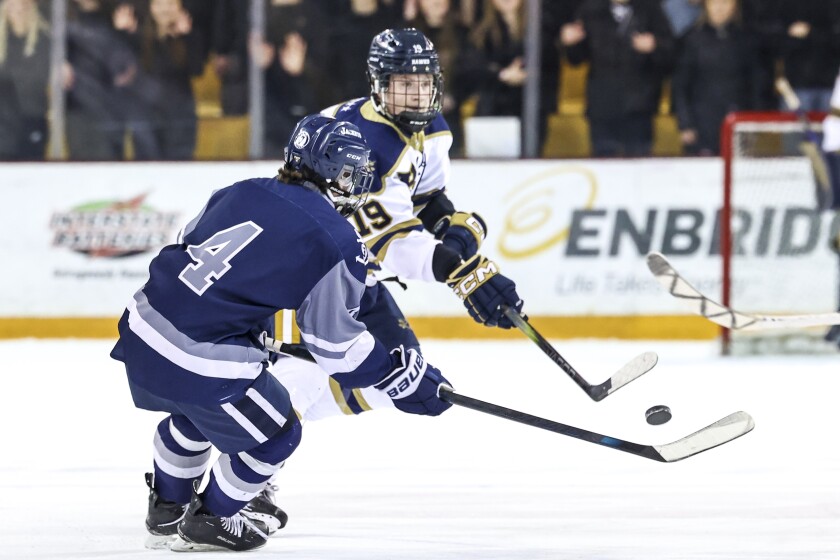 high school boys play ice hockey