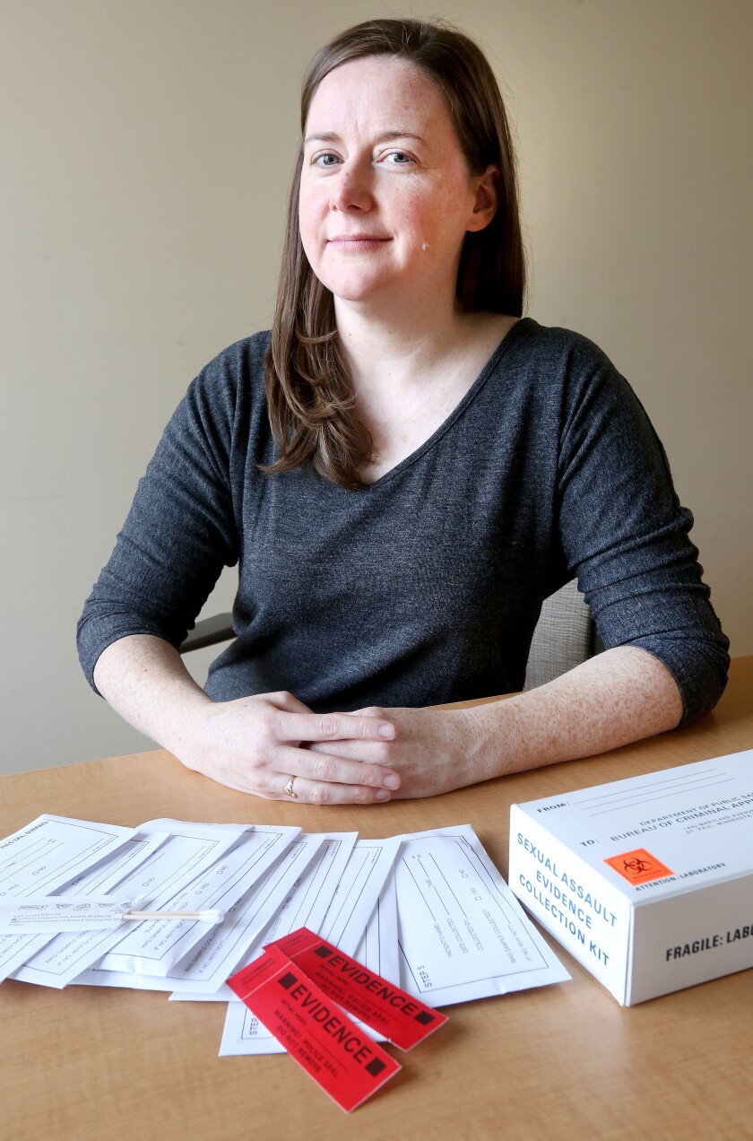 Mary Faulkner, site coordinator for the Sexual Assault Kit Initiative, displays the contents of one of the kits. It mostly contains pairs of swabs to collect evidence. The test is conducted by a nurse at a hospital; a police officer then collects the kit and sends it to the Bureau of Criminal Apprehension. Bob King / rking@duluthnews.com