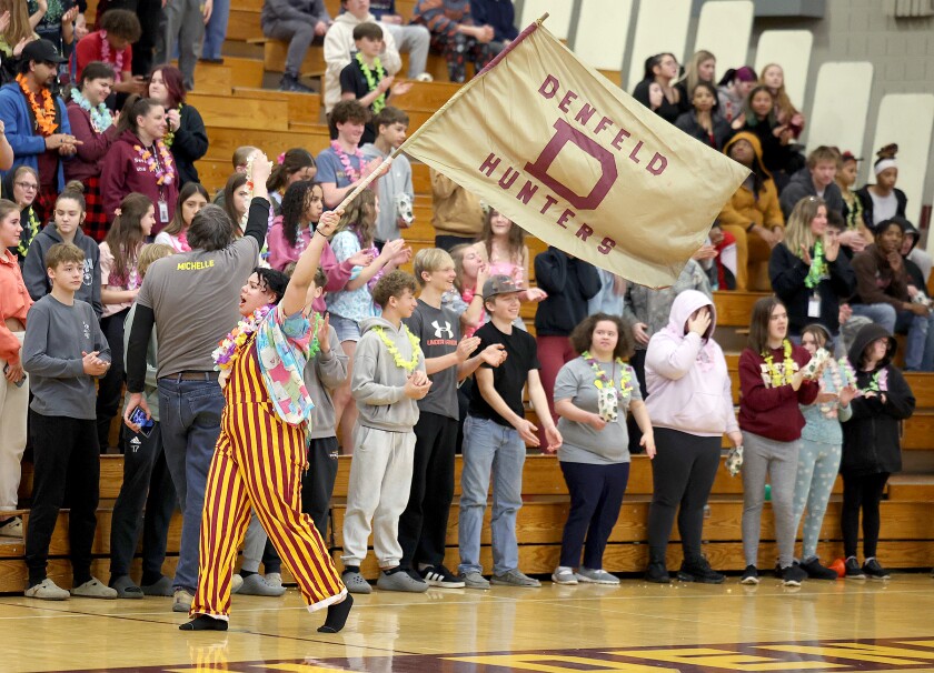 Student waves flag.